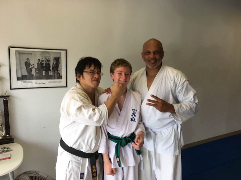 World Oyama Karate instructor Shihan Dai Takahashi with students Alex and Ernest Miller